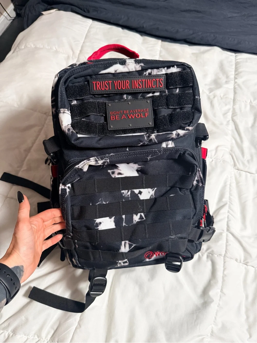 WOLF Black Backpack with Red Accents and White Marble Print